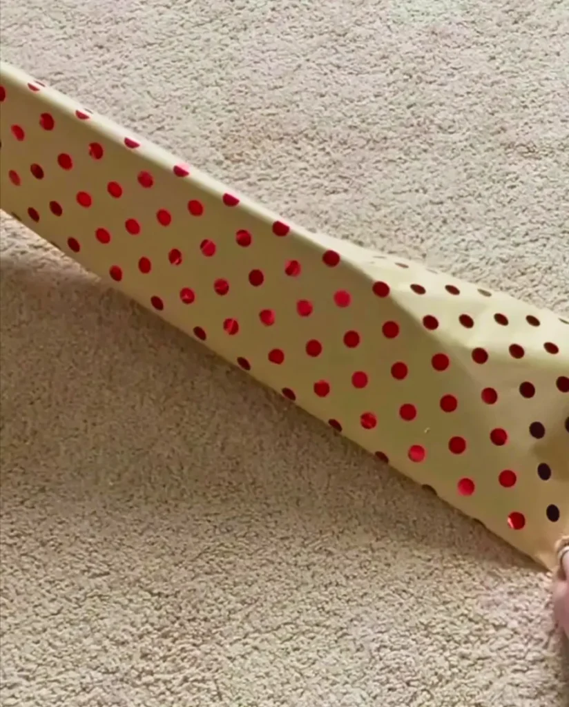 Decorative paper of skin color with red dots