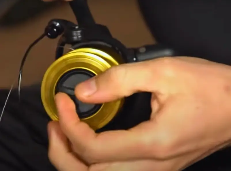 After tying an overhand knot, close the bail and check out the spool position