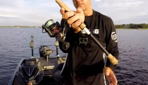 extend index finger along the top of the rod handle