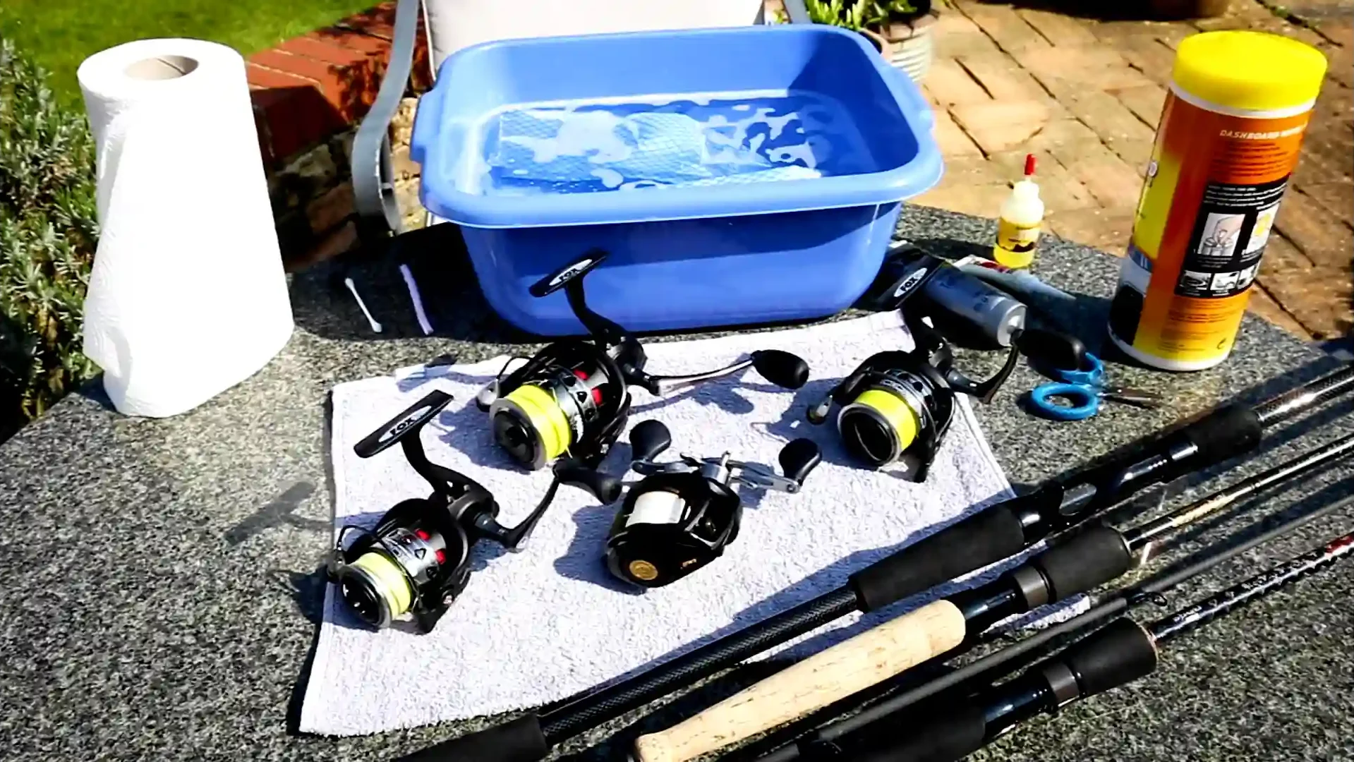 Rods, reels, clean cloth, small tub and water, tissue roll