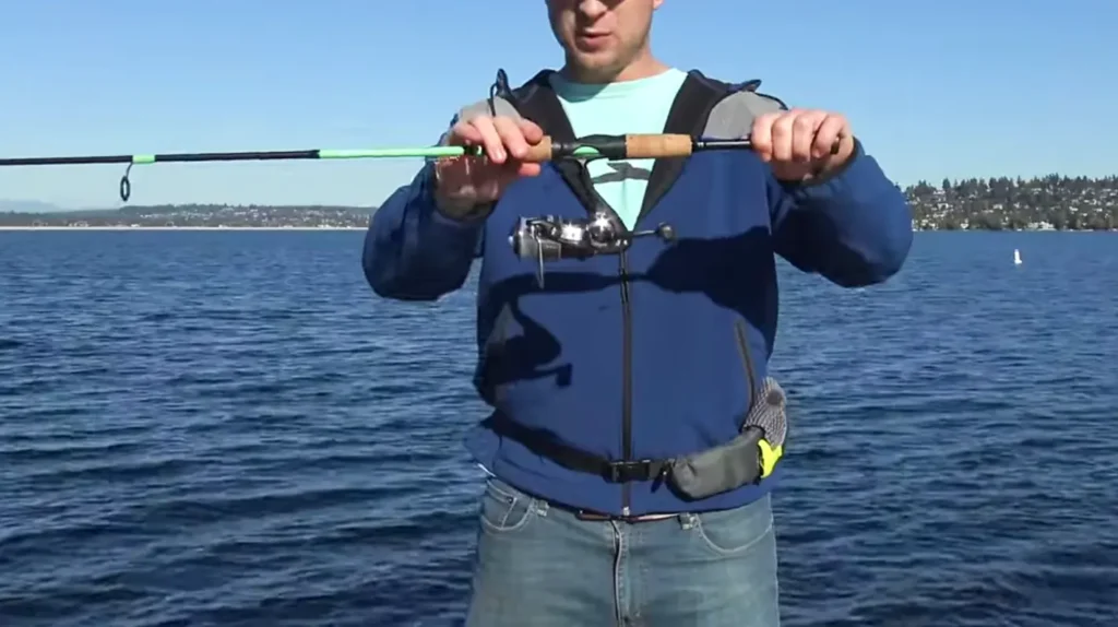 grasp the spinning rod handle securely but not too tightly