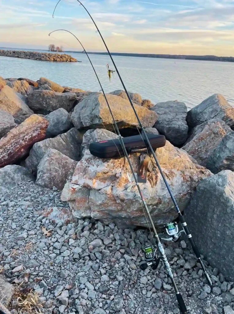 Fishing rods on big rocks  with sea view