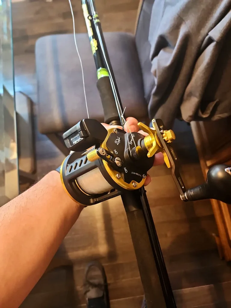 a person holding a conventional reel is also called a trolling reel 