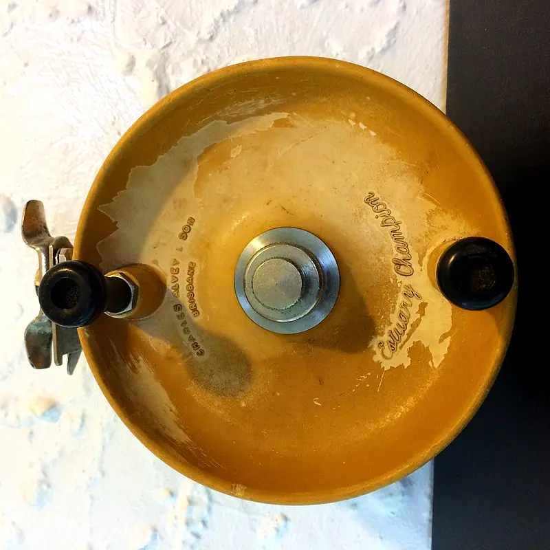 a close up of a yellow Side-cast Reel